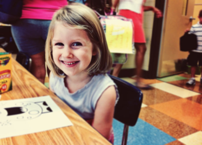 Cara at her desk first day of kindergarten